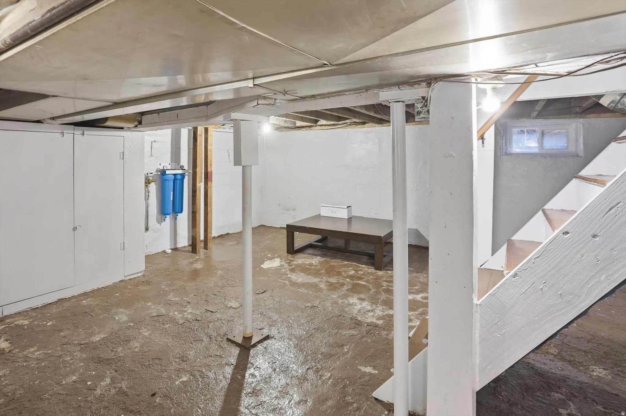 Unfinished basement with stairway