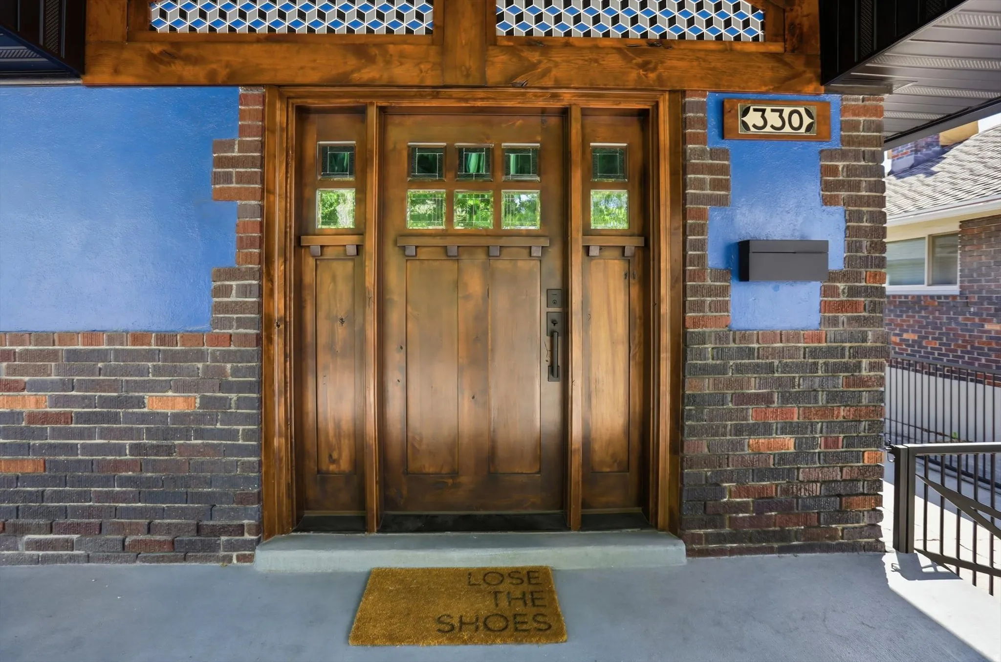 Doorway to property with brick siding