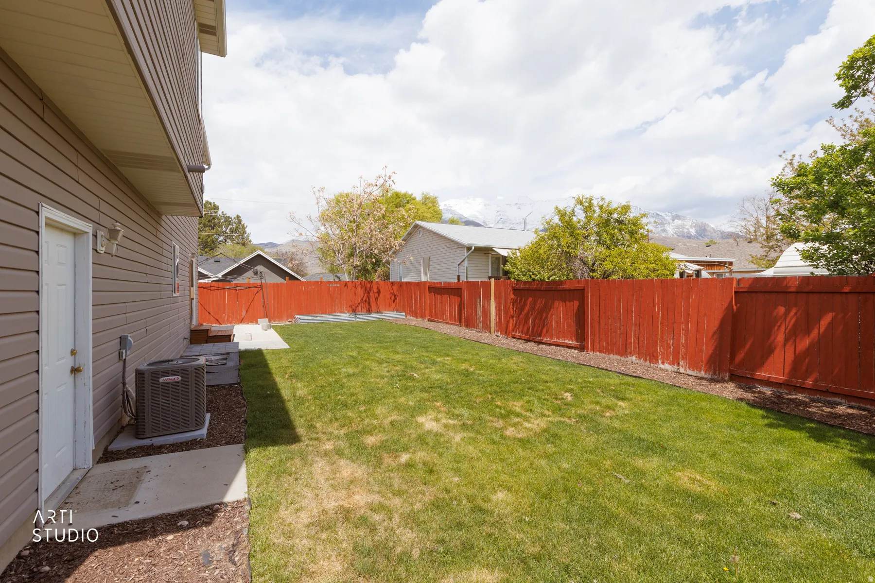 View of fenced backyard