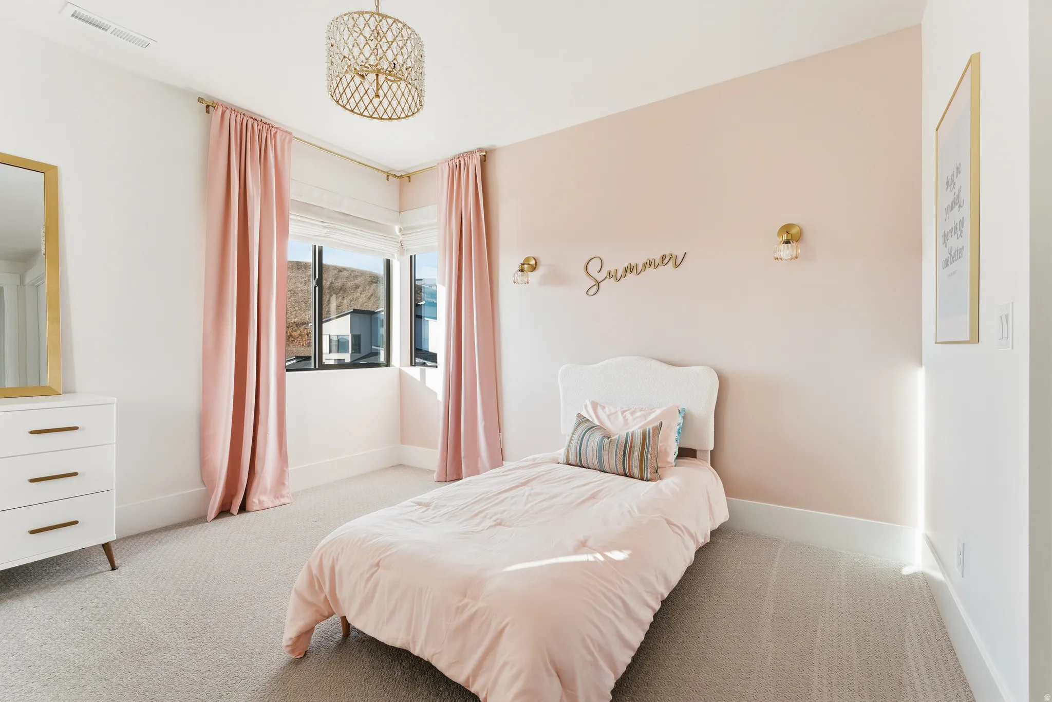 Bedroom featuring light colored carpet and baseboards