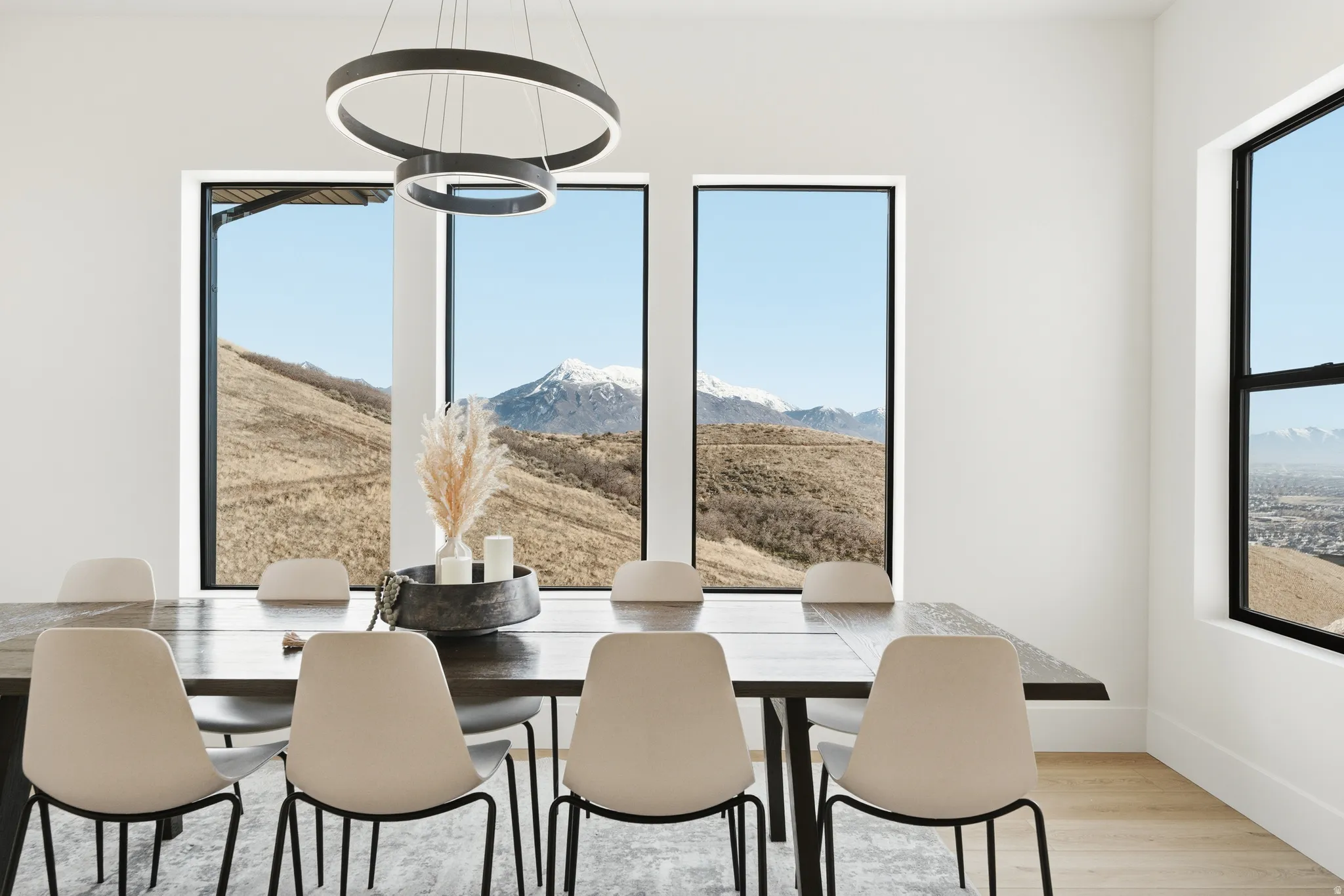 Dining space featuring light wood-style flooring and a mountain view