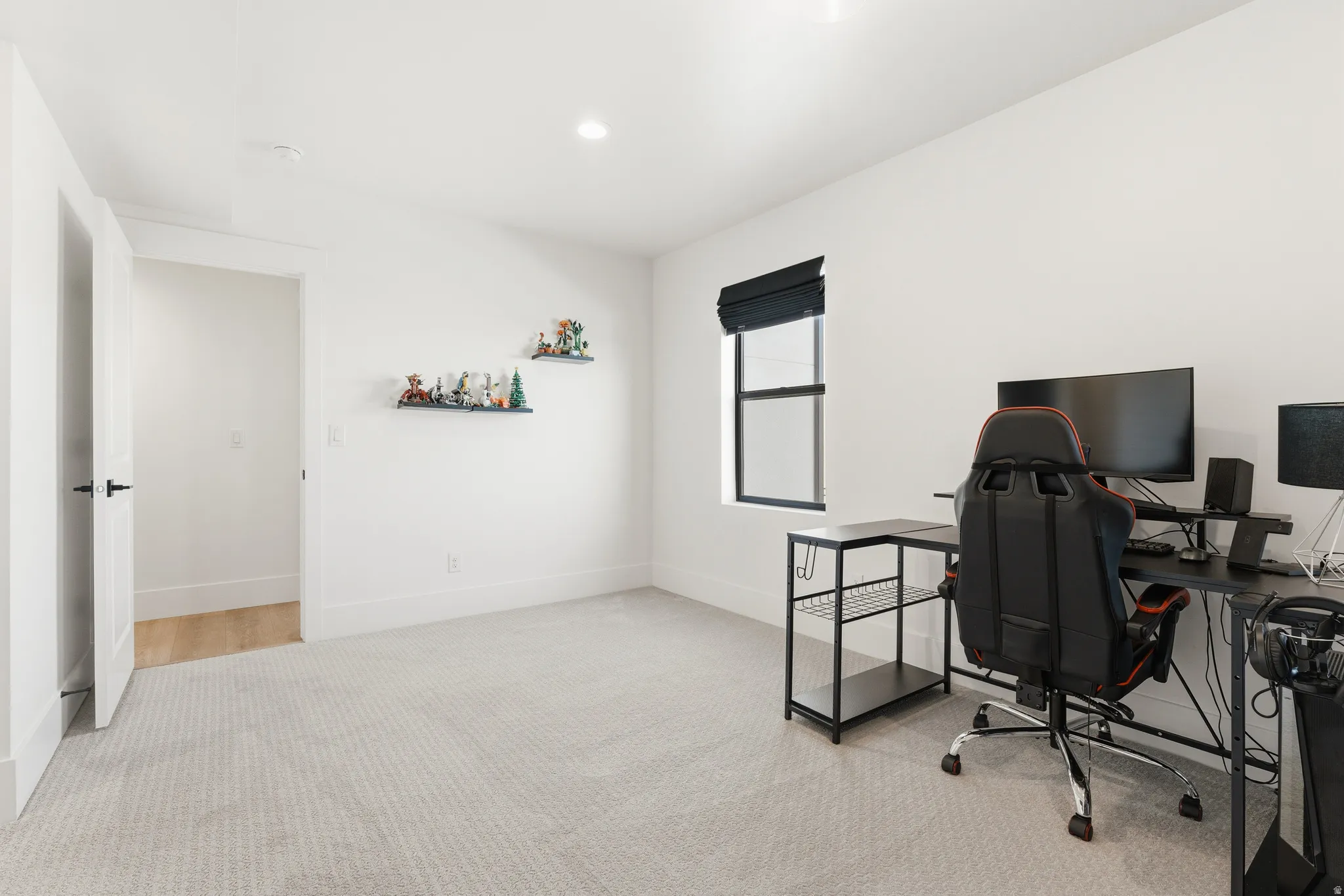 Home office featuring light colored carpet and recessed lighting