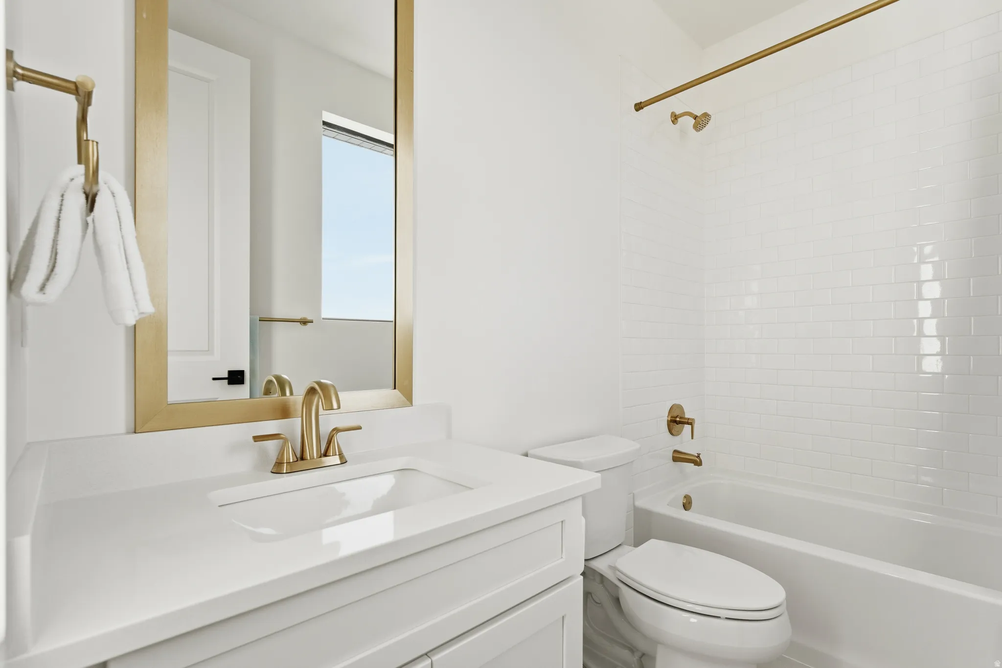 Bathroom featuring vanity and tub / shower combination