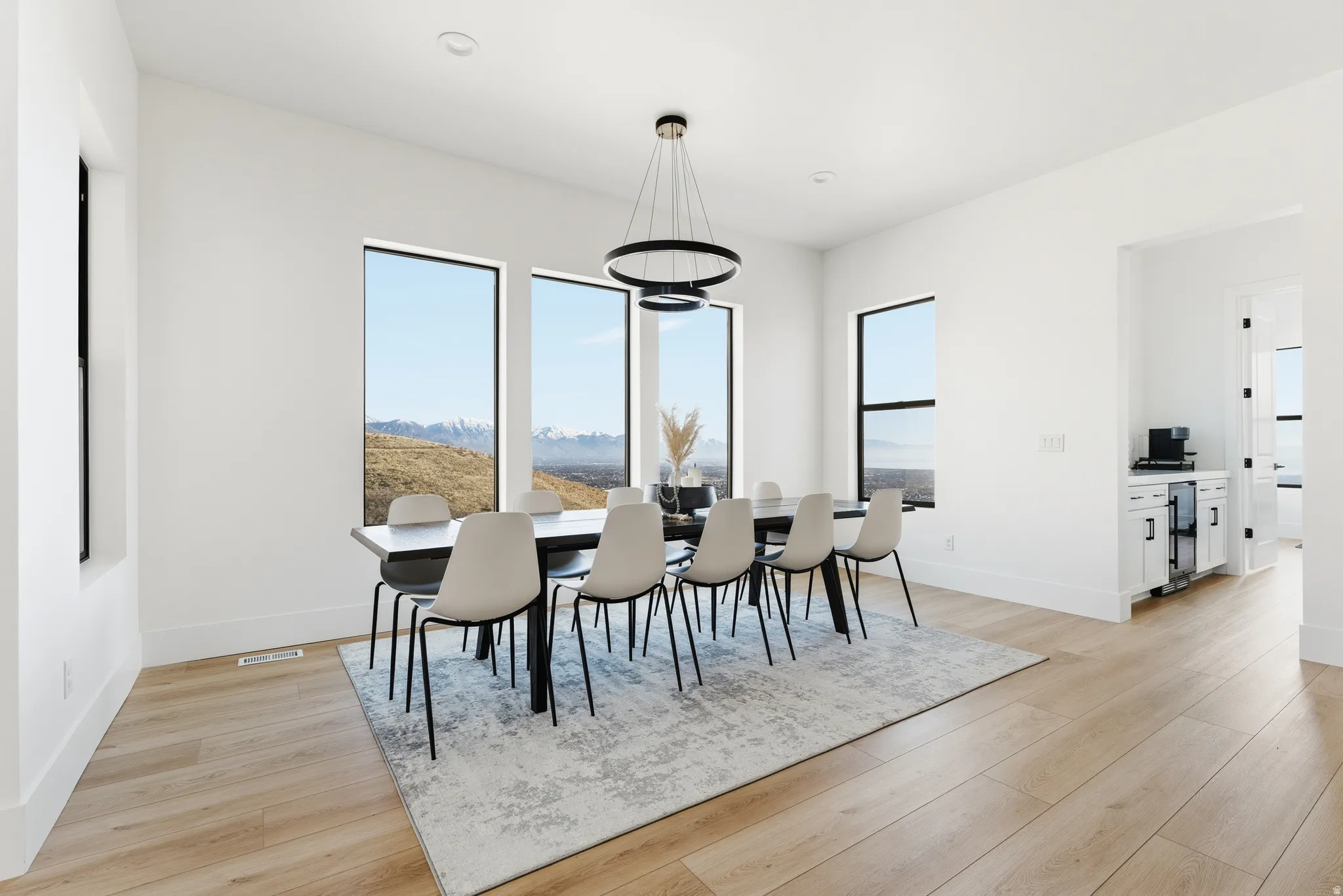 Dining space featuring light wood-style flooring and a mountain view