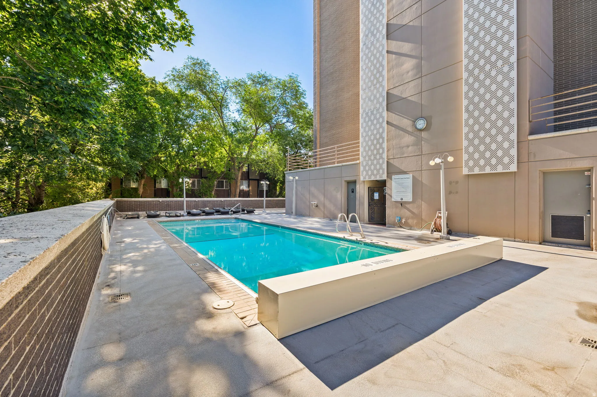 Community pool with a patio area
