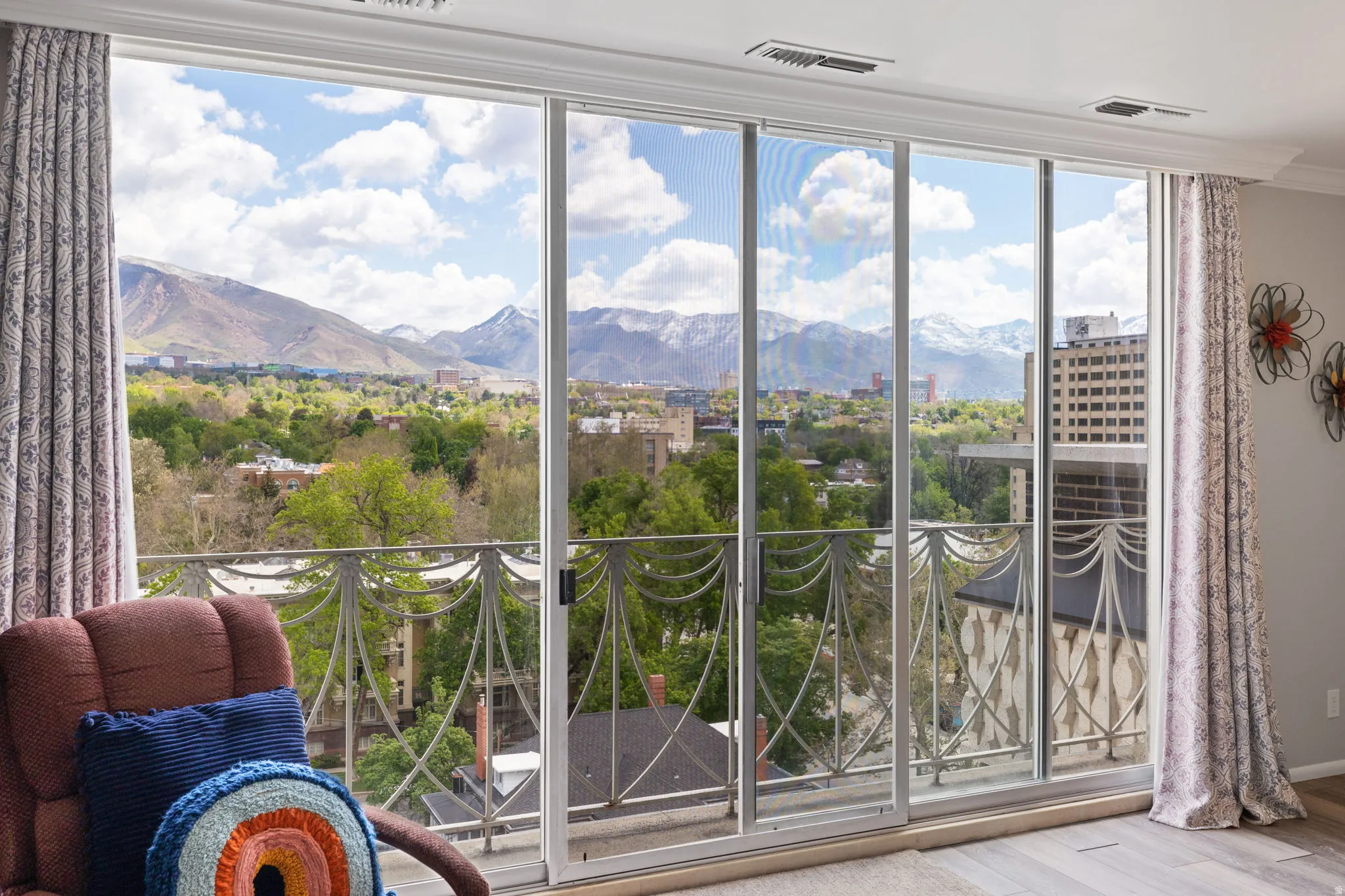 Doorway to outside featuring a mountain view, wood finished floors, and ornamental molding