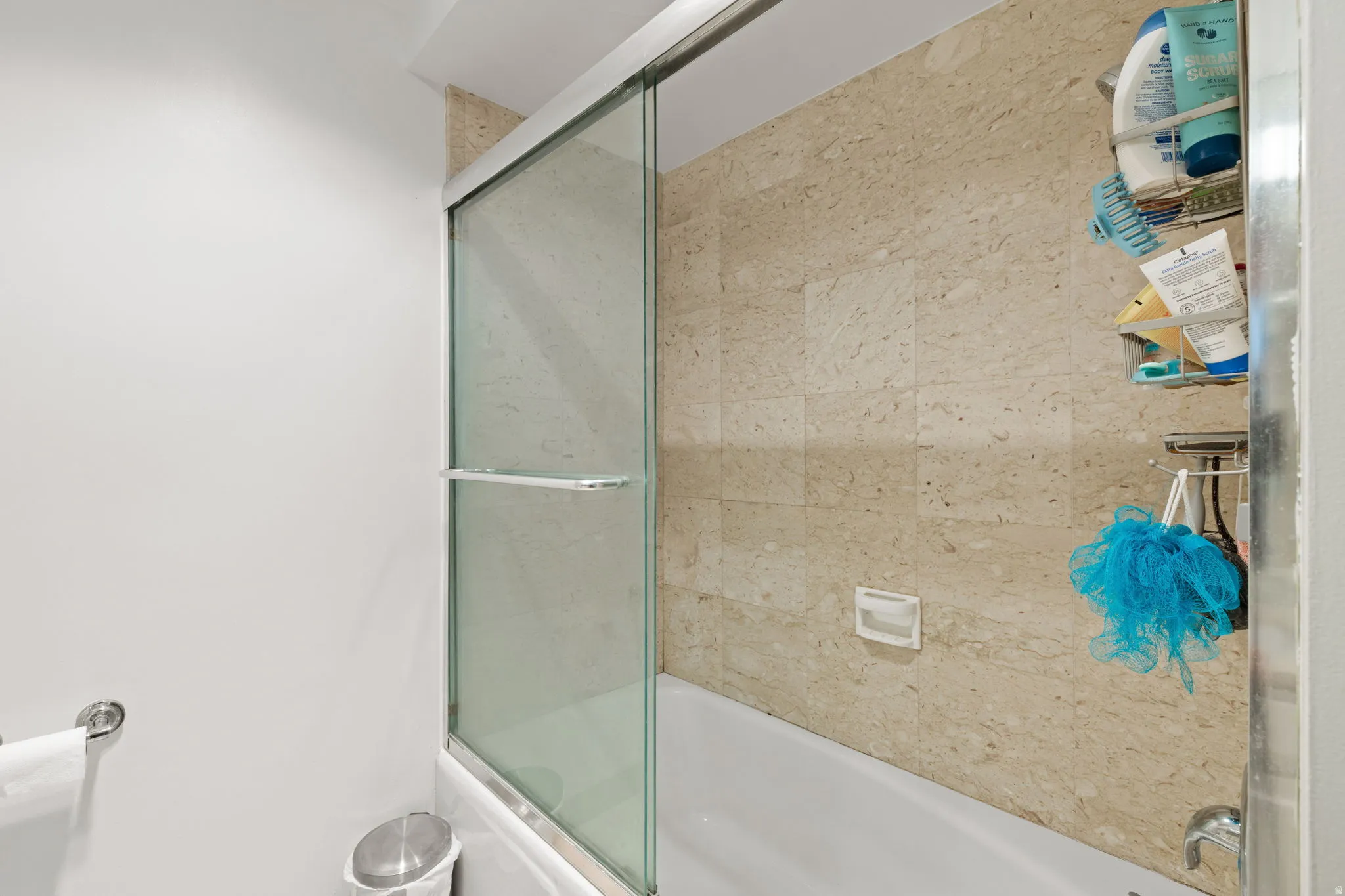 Bathroom featuring enclosed tub / shower combo