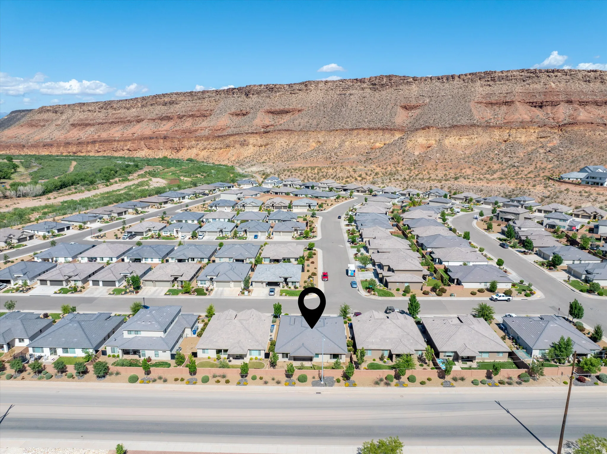 Aerial view of residential area featuring a mountainous background