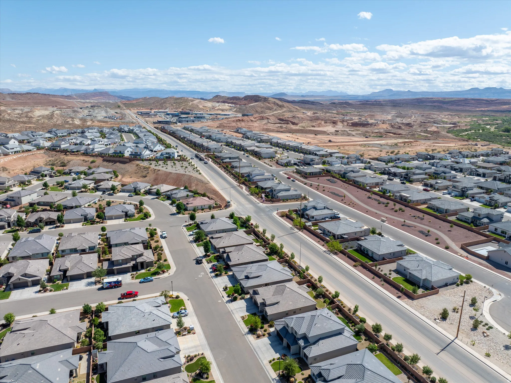 Aerial view of residential area featuring mountains