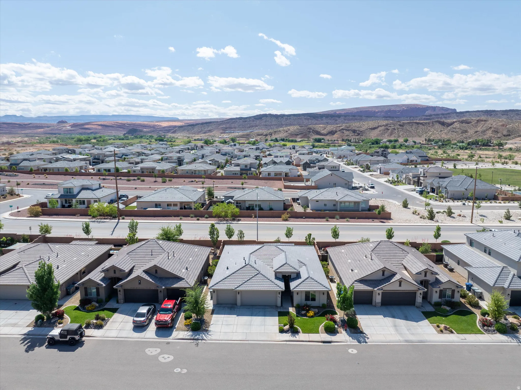 Aerial view of residential area featuring a mountainous background