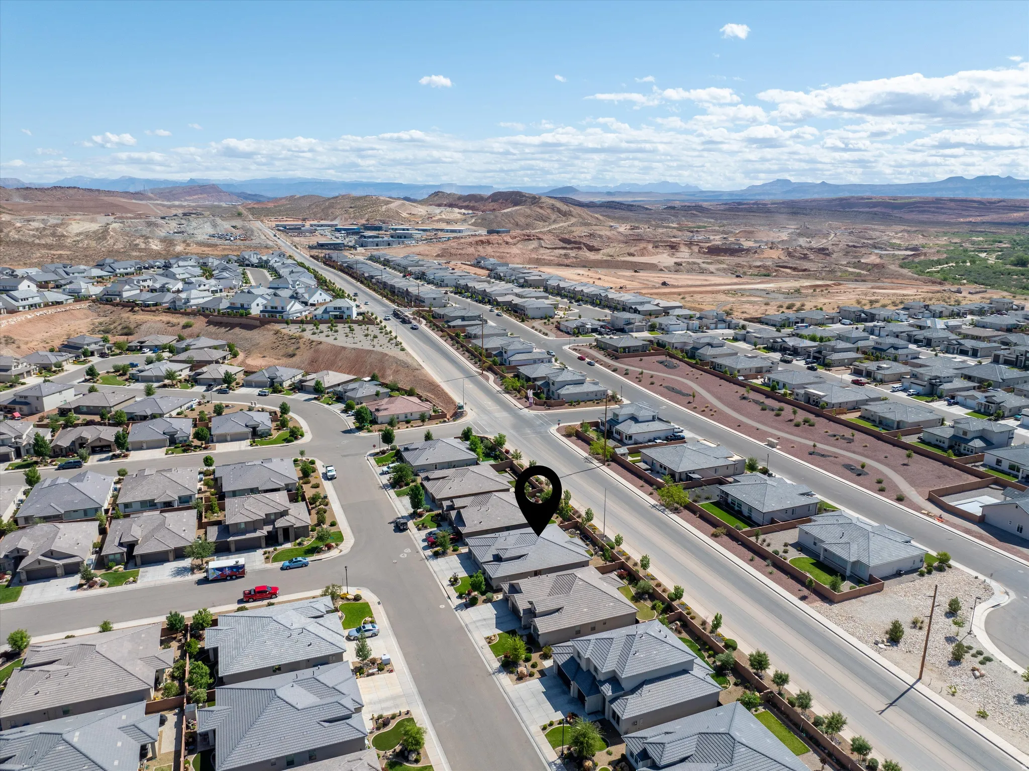 Aerial view of residential area with a mountainous background