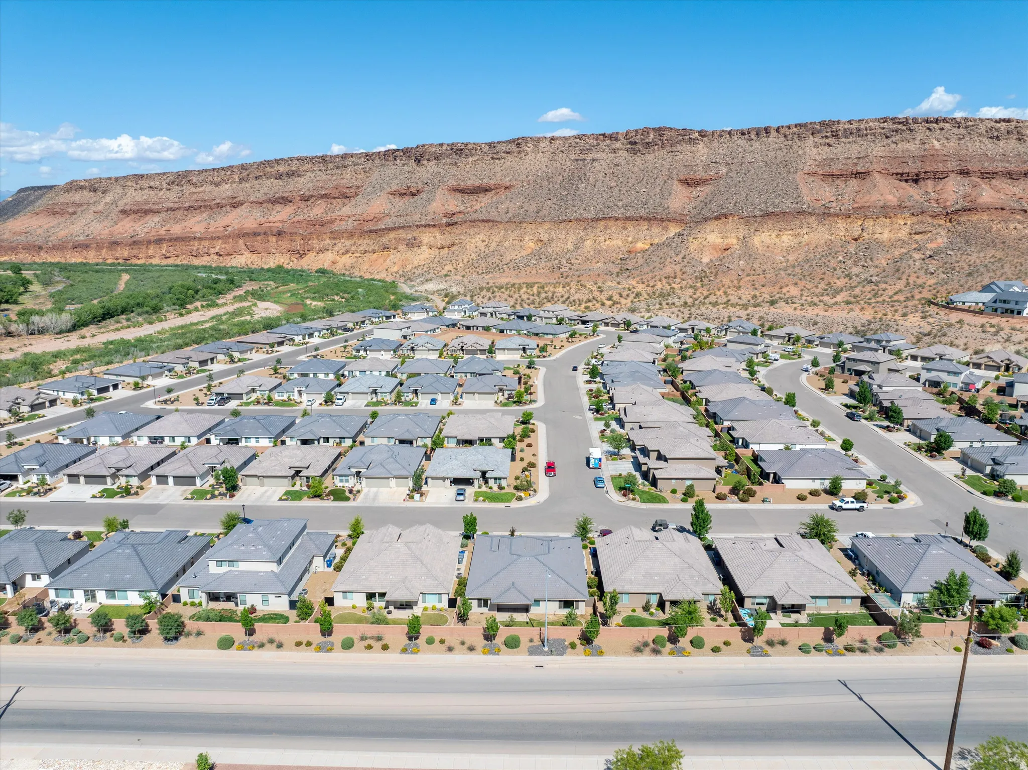 Aerial perspective of suburban area featuring a mountainous background