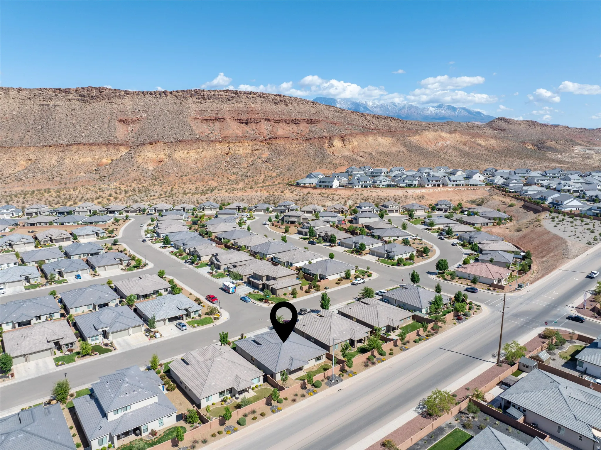 Aerial view of residential area with a mountain backdrop