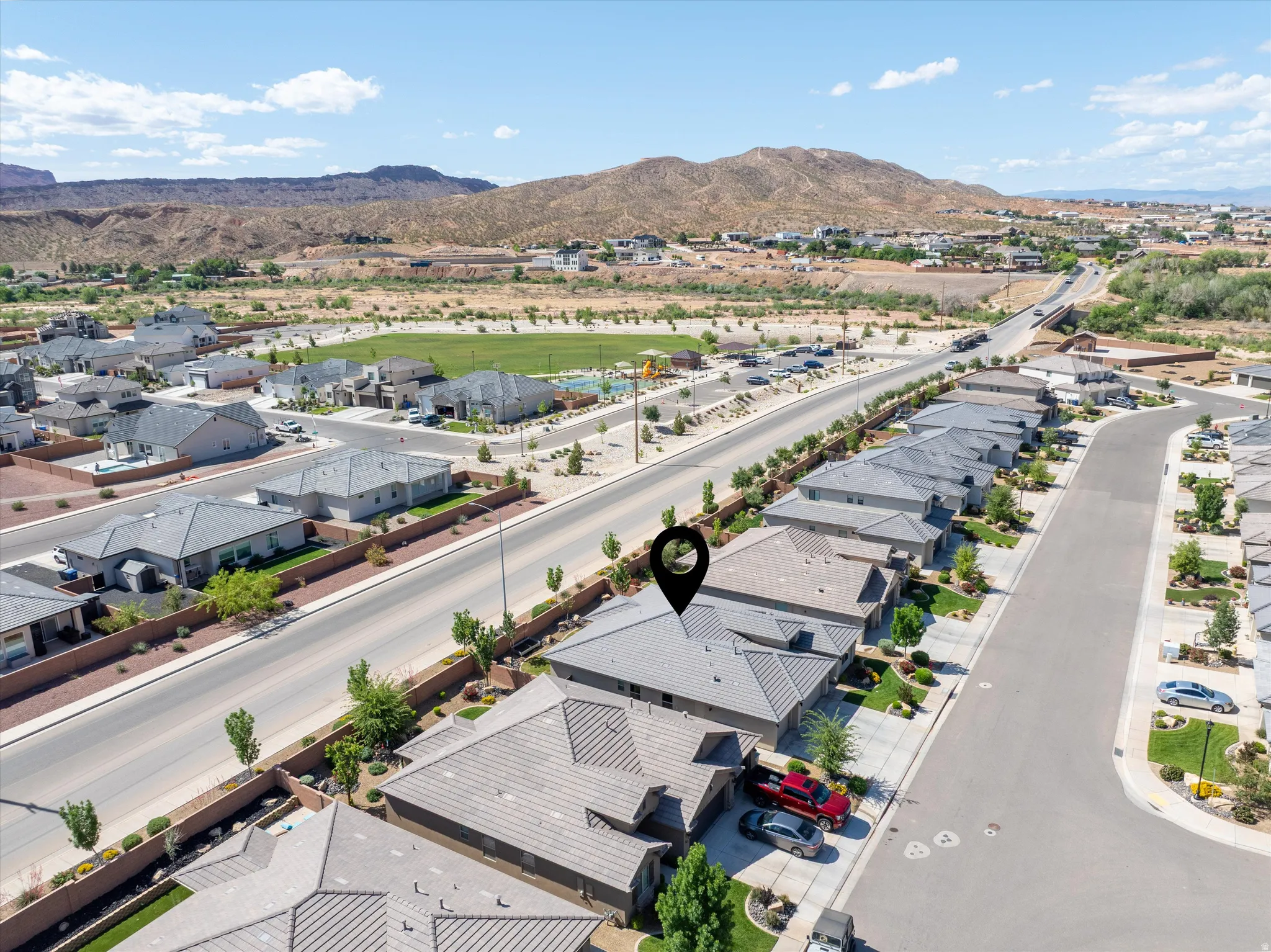 Aerial perspective of suburban area with a mountainous background