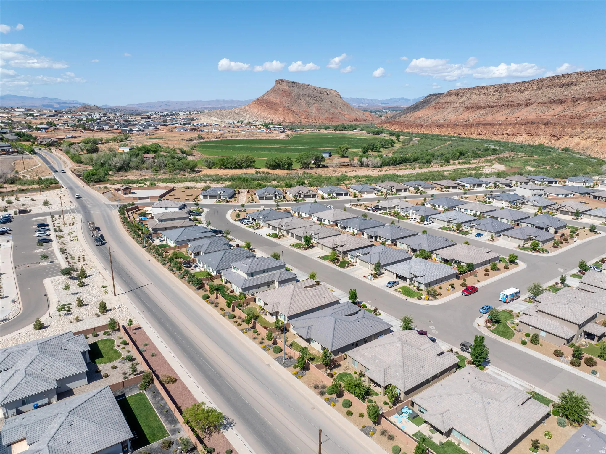 Aerial perspective of suburban area featuring a mountainous background