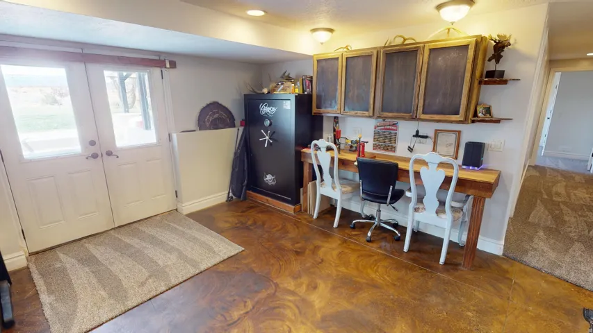 Office area with french doors and built in desk
