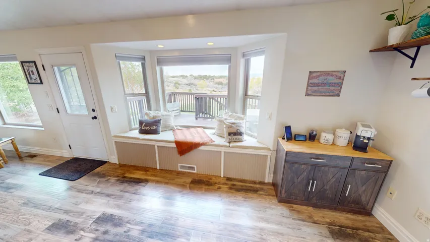 Entrance foyer with light wood-style floors and recessed lighting