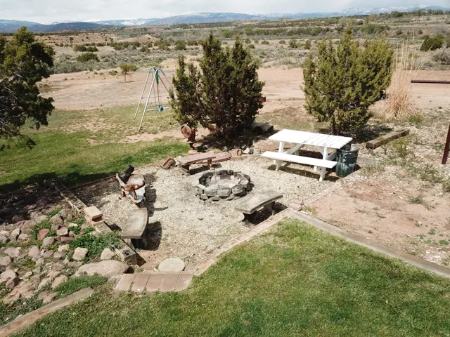 Aerial view of sparsely populated area with a mountainous background
