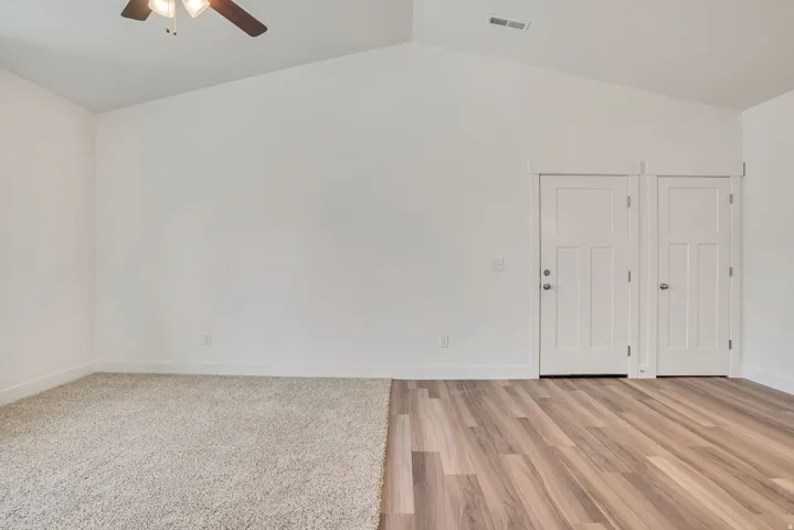 Spare room featuring light wood finished floors and a ceiling fan