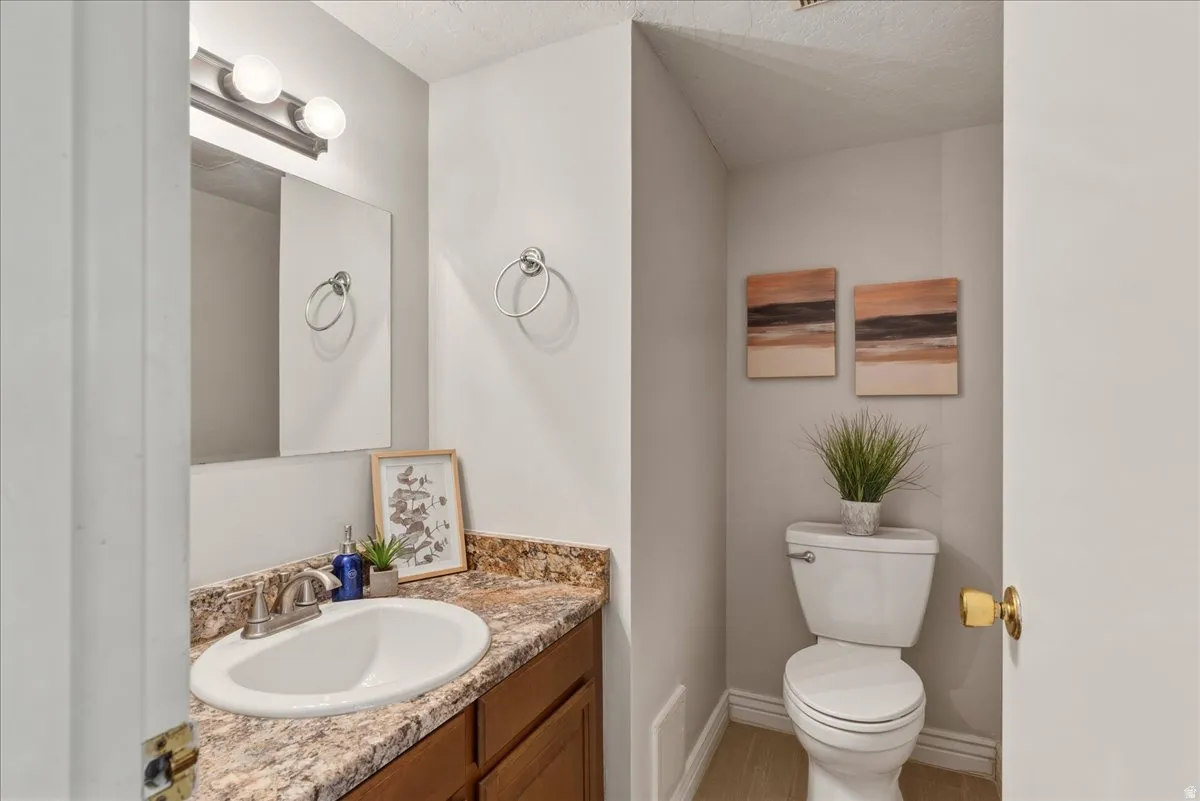 Bathroom with vanity and toilet