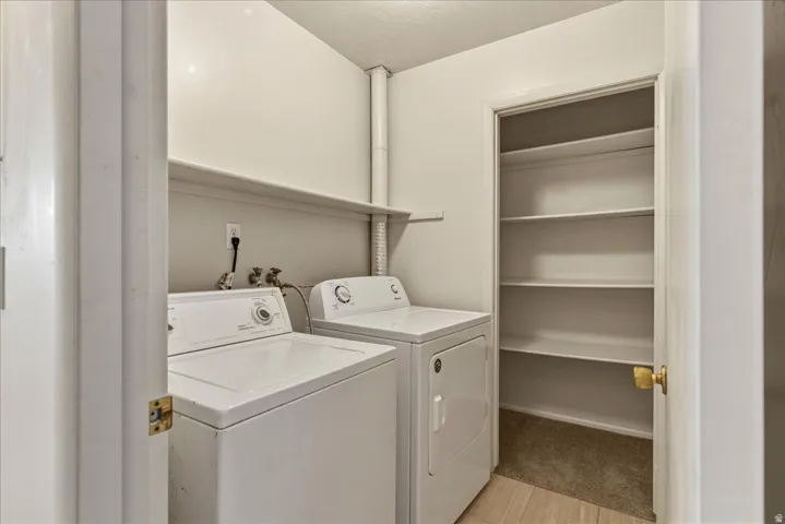 Laundry area featuring independent washer and dryer