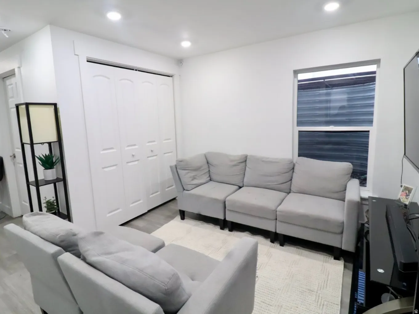 Living room featuring recessed lighting and light wood-type flooring
