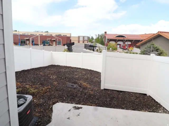 View of fenced backyard