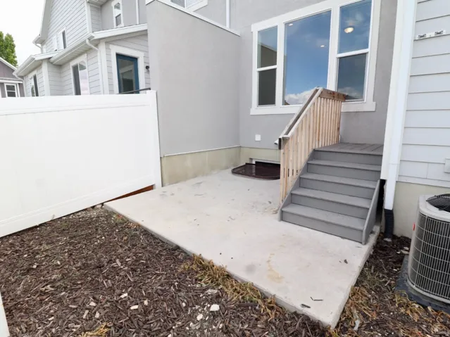 Entrance to property featuring a patio area and stucco siding