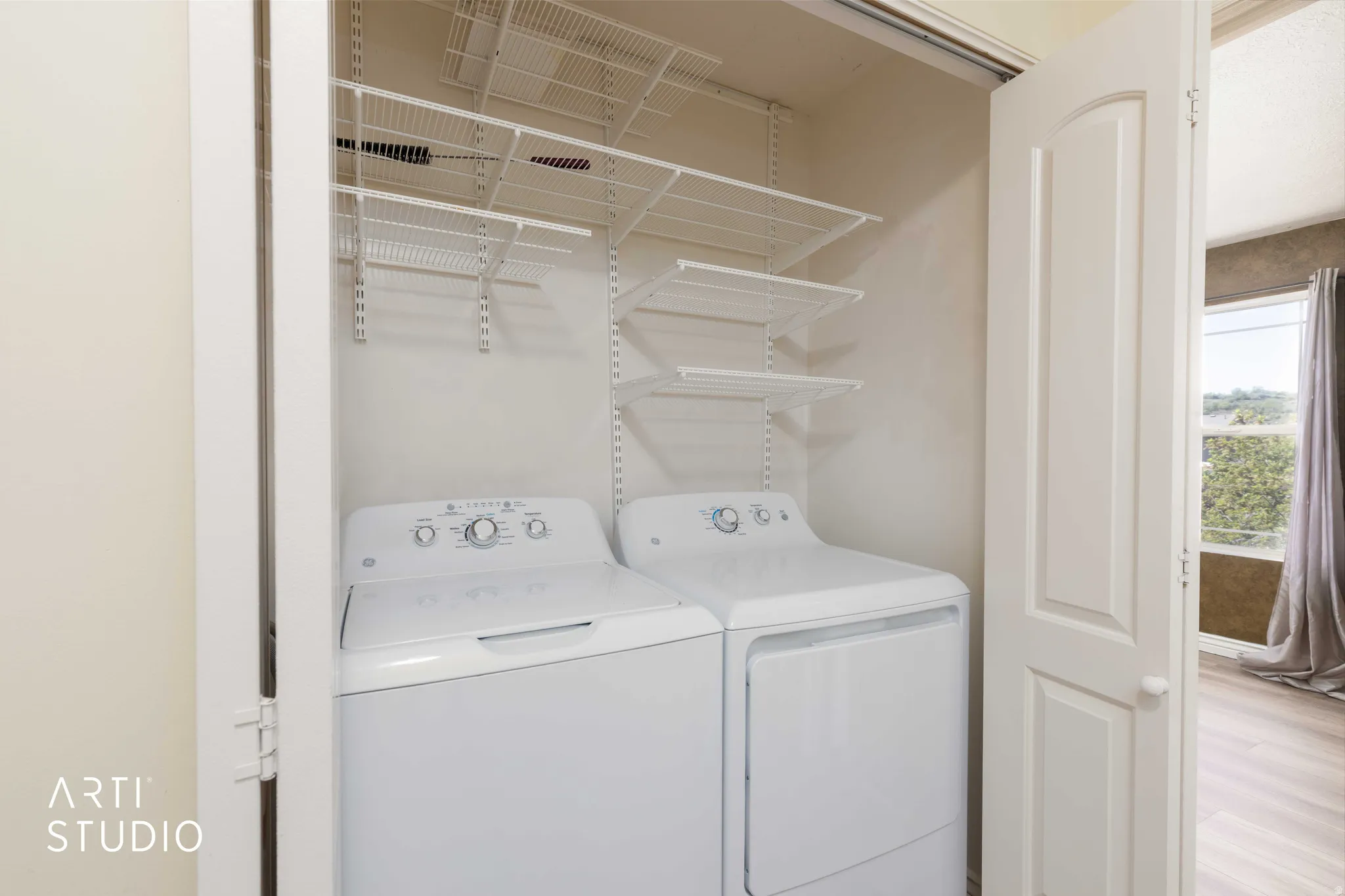 Laundry area featuring separate washer and dryer