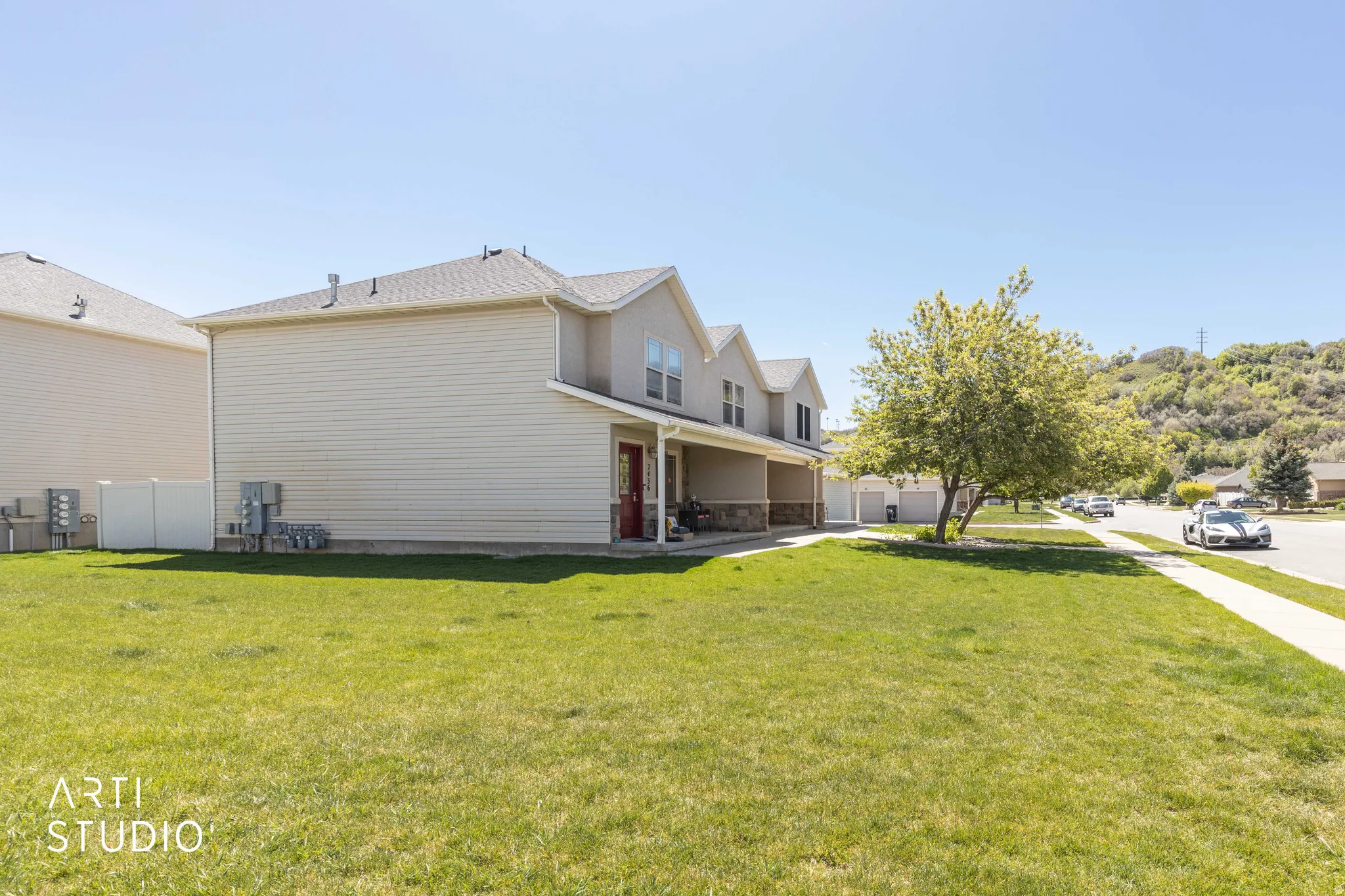 View of home's exterior with a lawn and a patio area