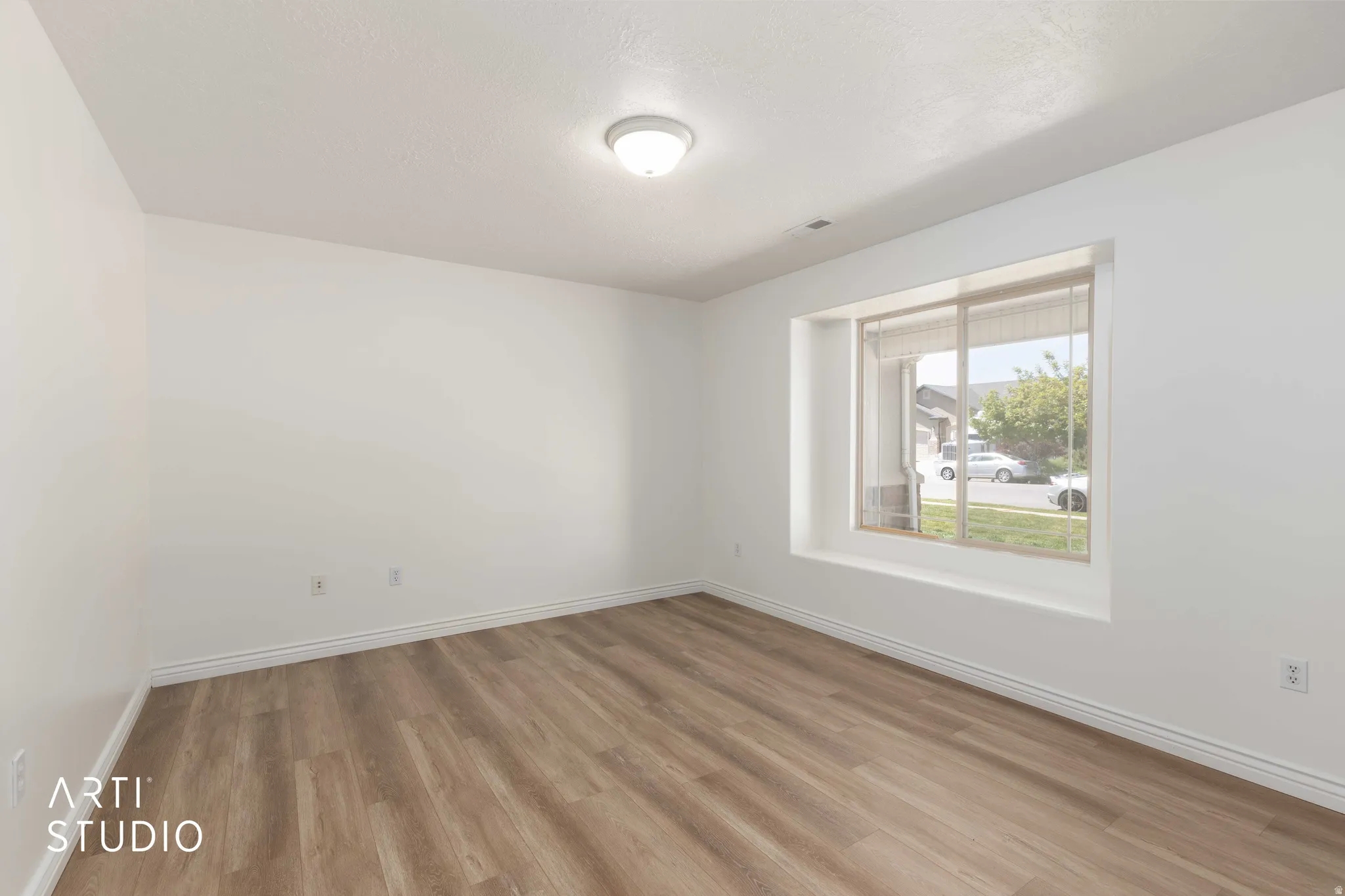 Unfurnished room with wood finished floors