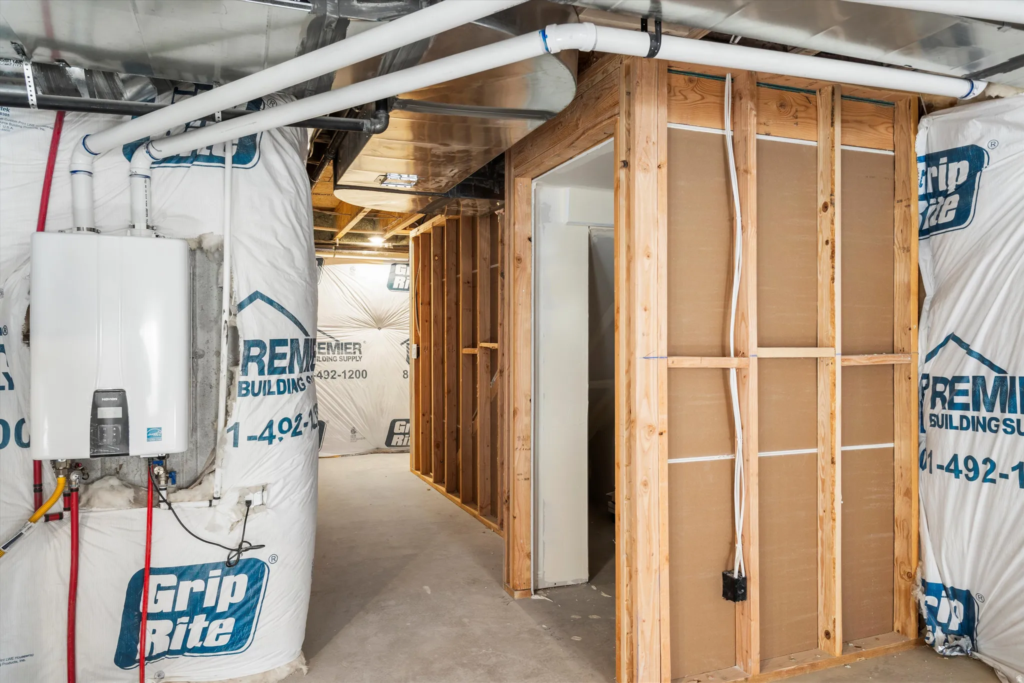 Unfinished below grade area with tankless water heater