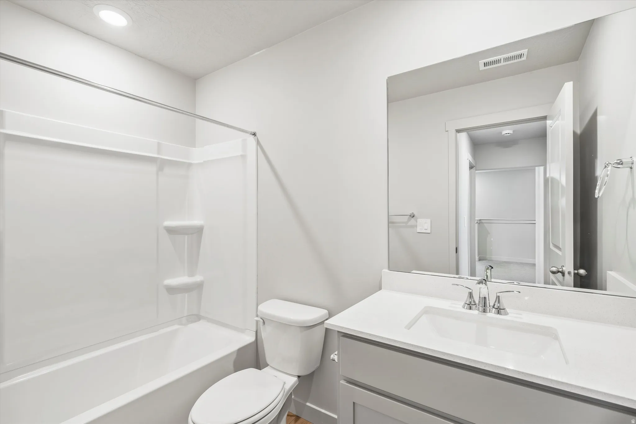 **DISCLAIMER** Interior package & color may vary. Bathroom featuring vanity, shower / bath combination, and recessed lighting