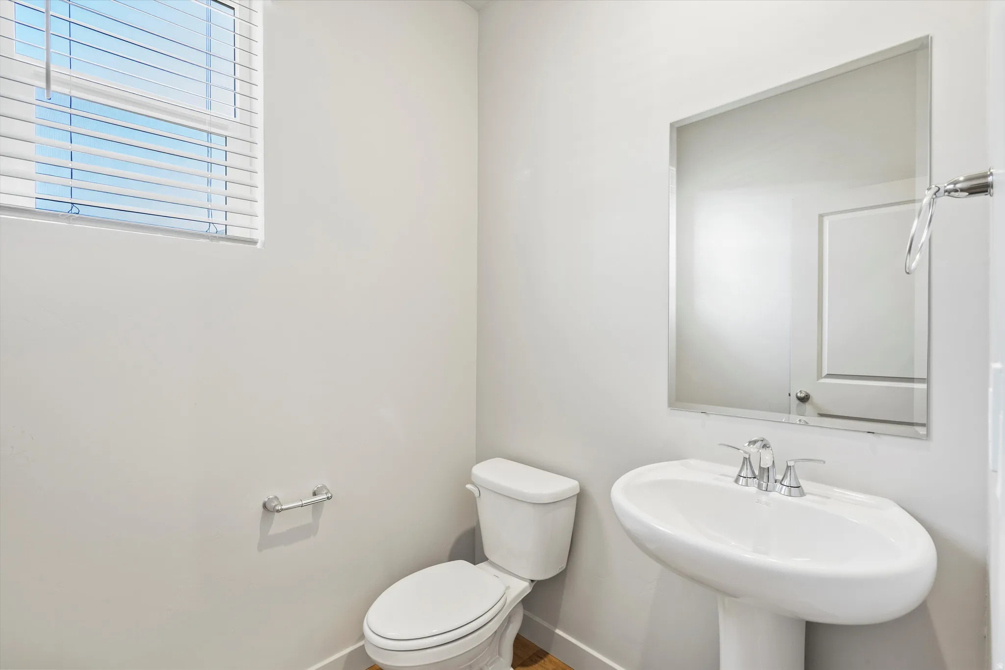 **DISCLAIMER** Interior package & color may vary. Half bathroom featuring toilet and baseboards