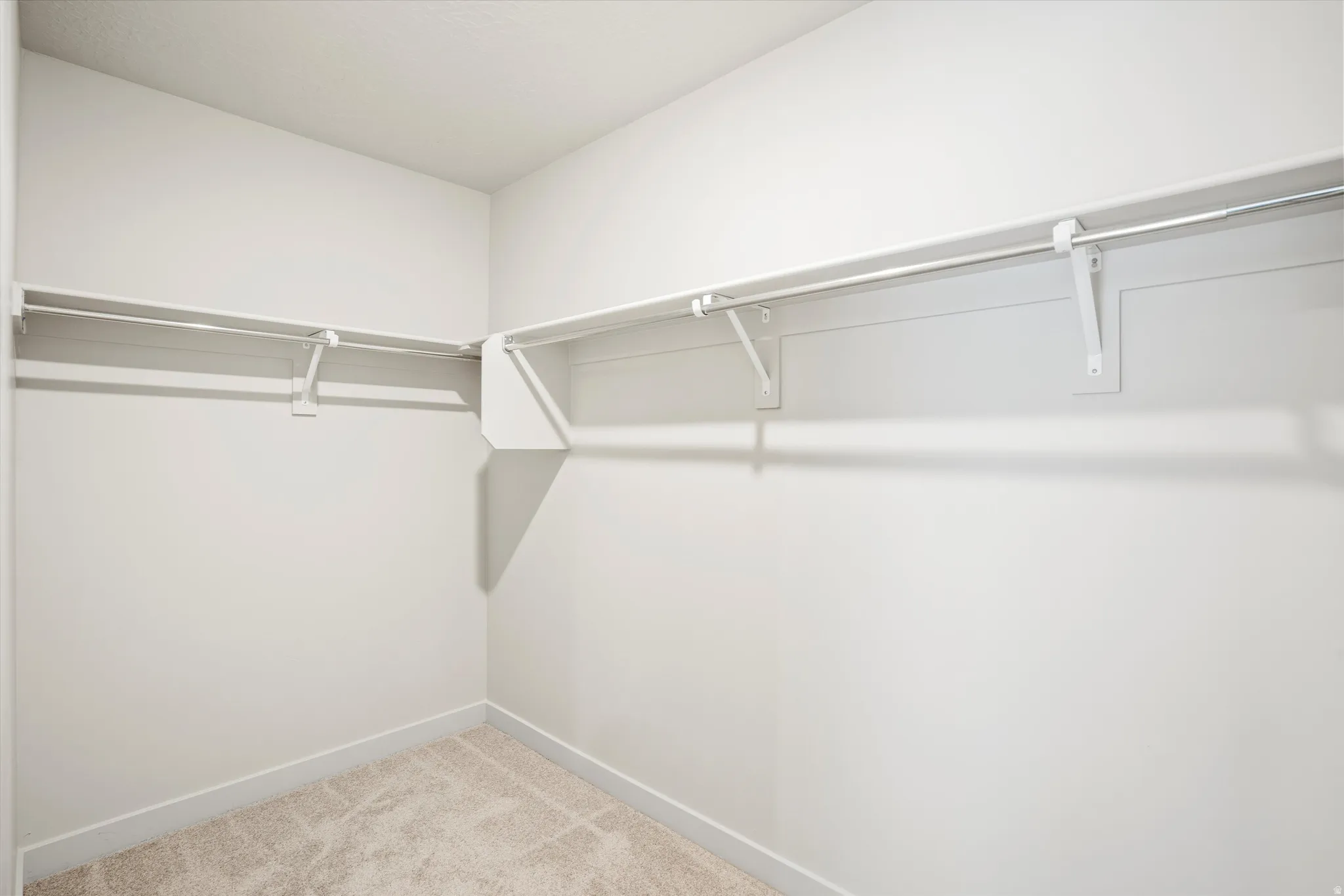 **DISCLAIMER** Interior package & color may vary. Walk in closet with light colored carpet