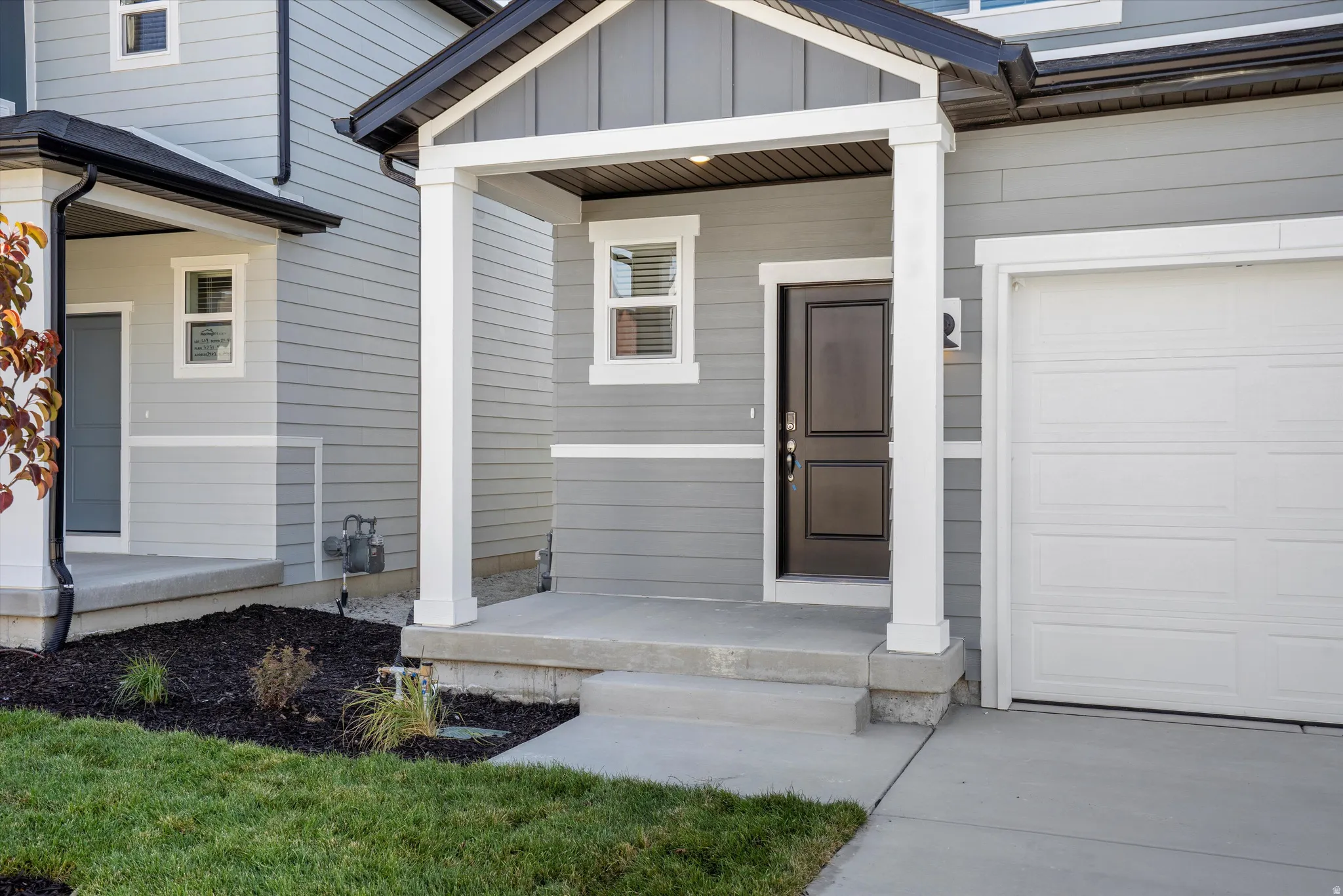 Property entrance featuring board and batten siding
