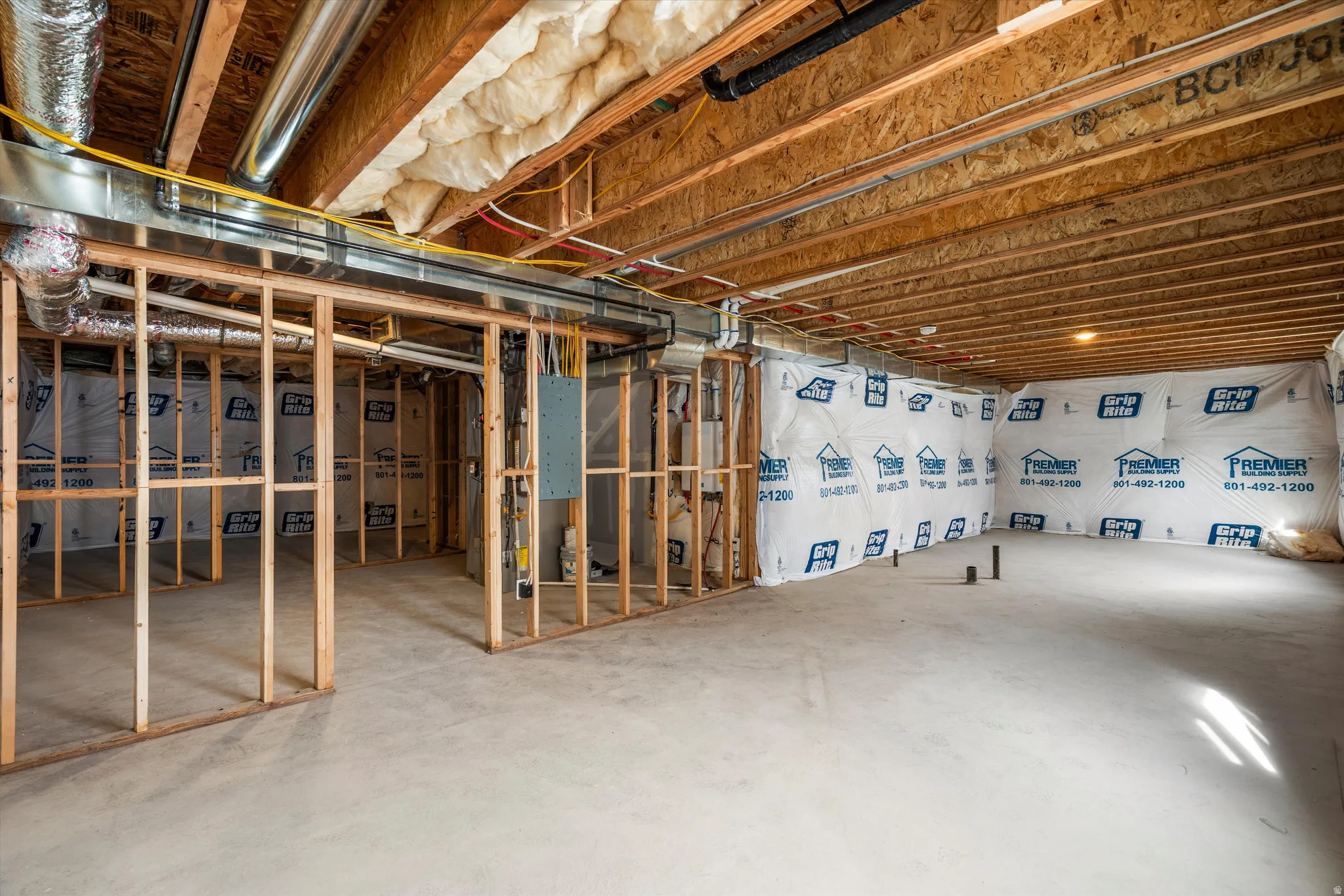 Unfinished below grade area with electric panel