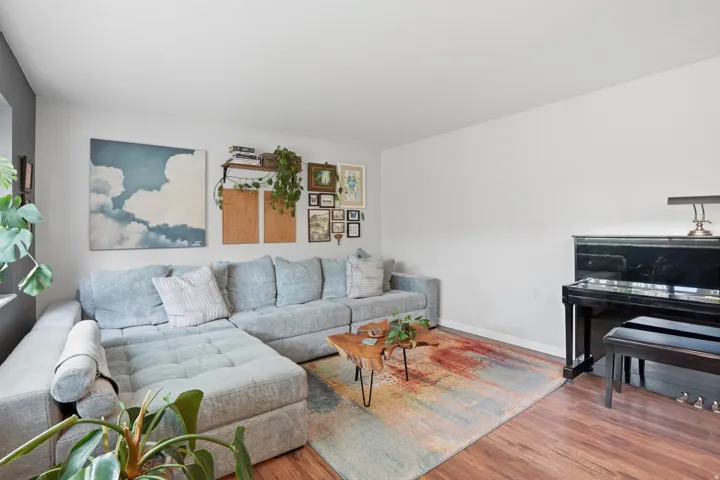Living area featuring wood finished floors and baseboards