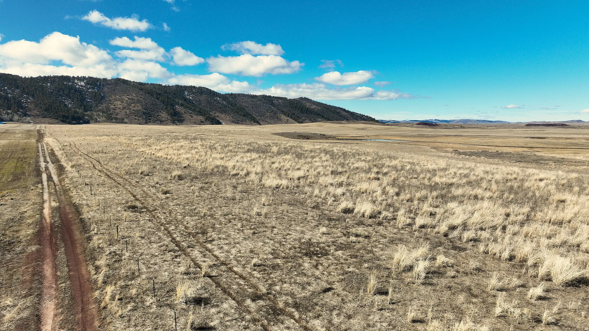 View of mountain background featuring rural landscape