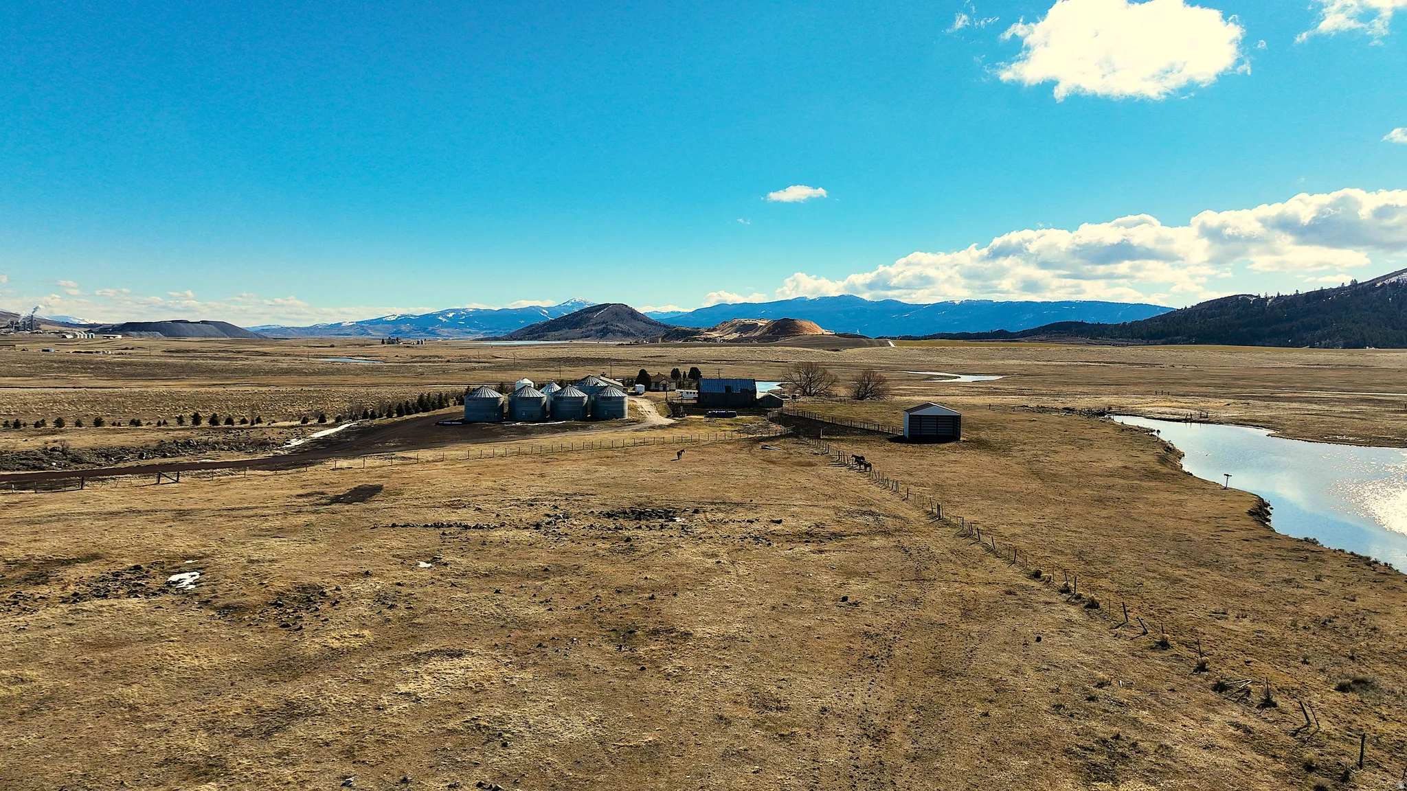 Mountain view with a large body of water and rural landscape