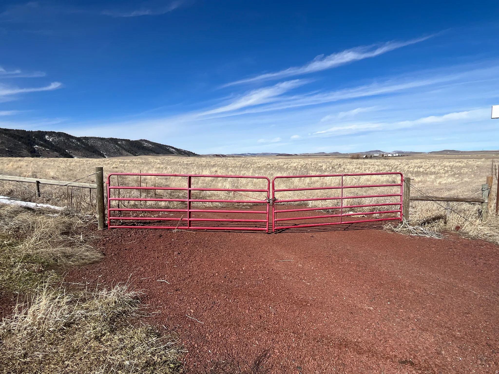Gate with a mountain view and a view of rural / pastoral area