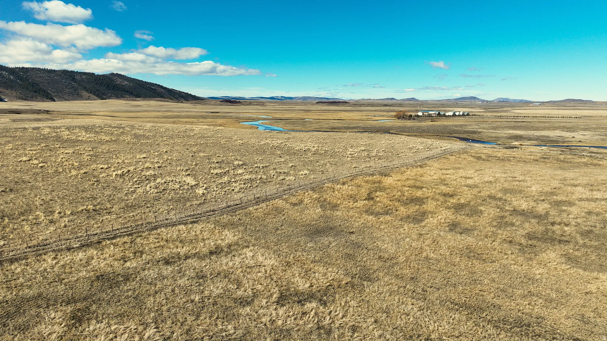 View of yard featuring a mountain view and a view of countryside