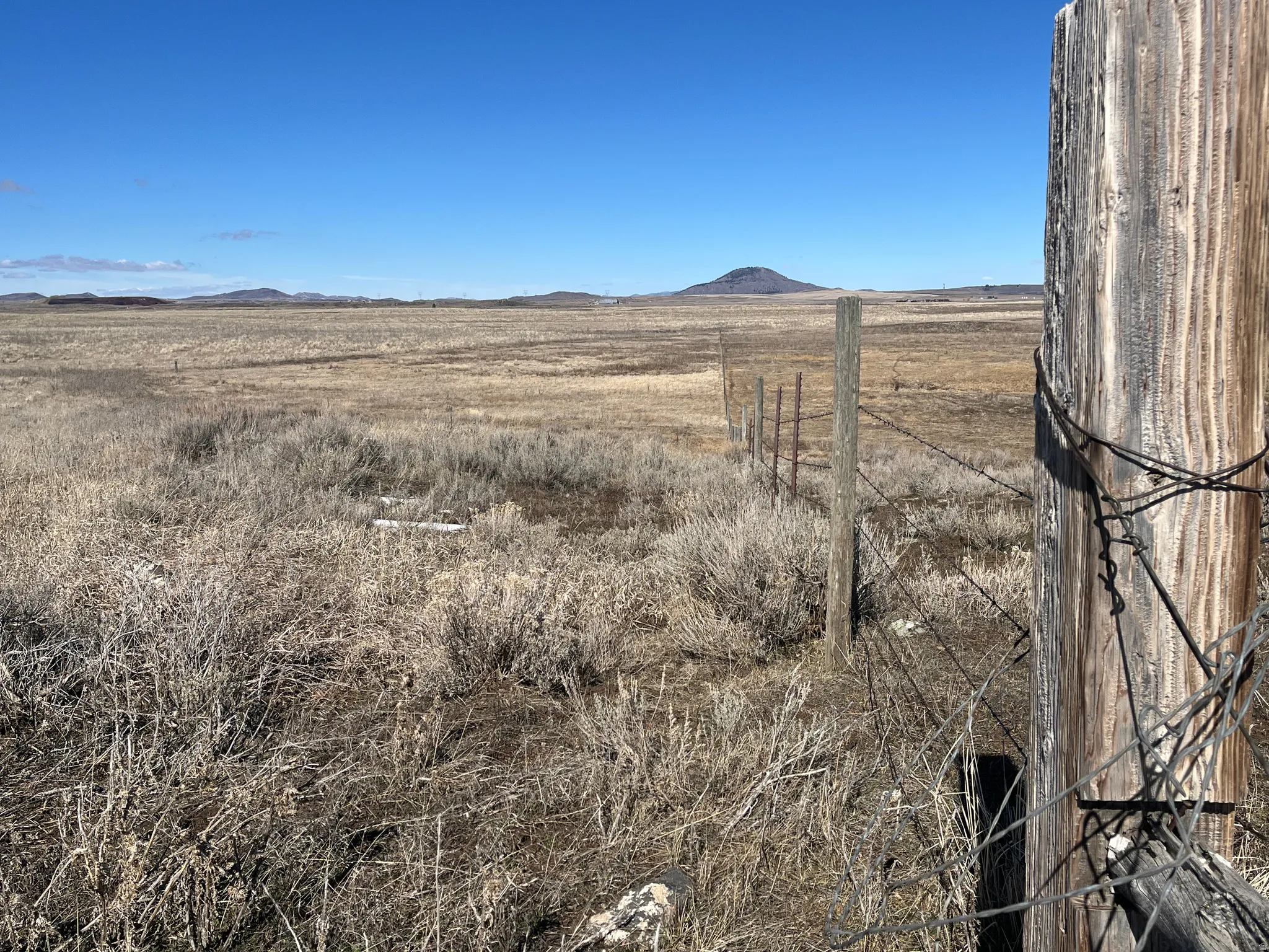 View of mountain backdrop featuring rural landscape