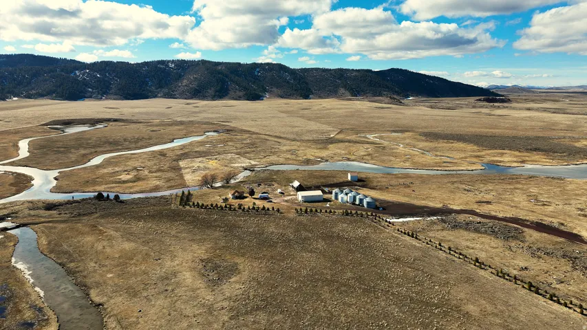 Overview of rural landscape with a mountain backdrop