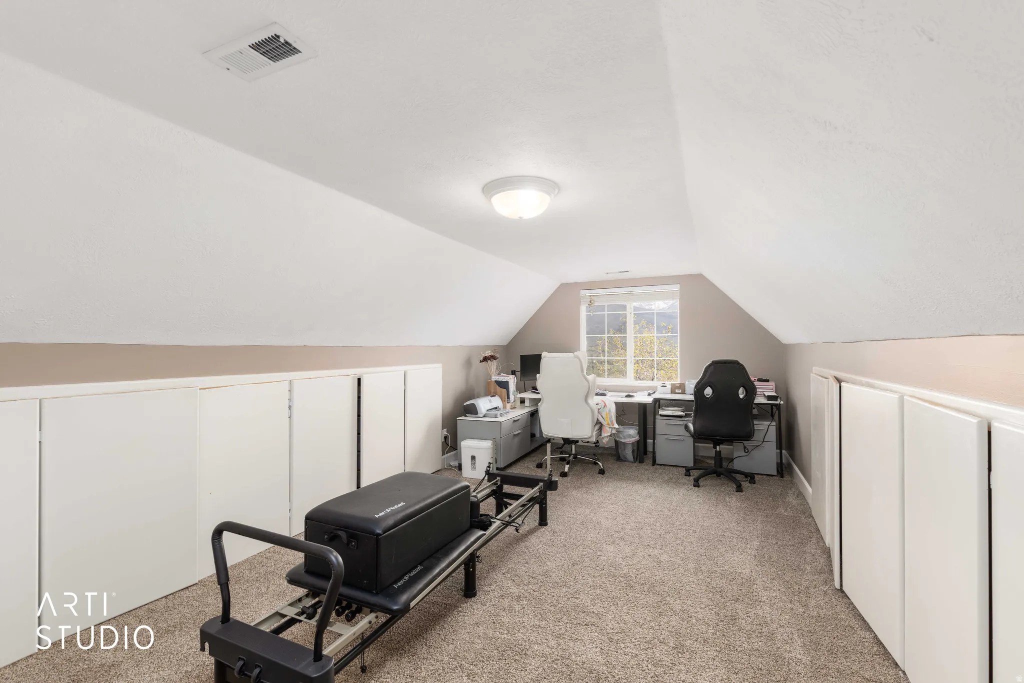 Office space featuring light carpet