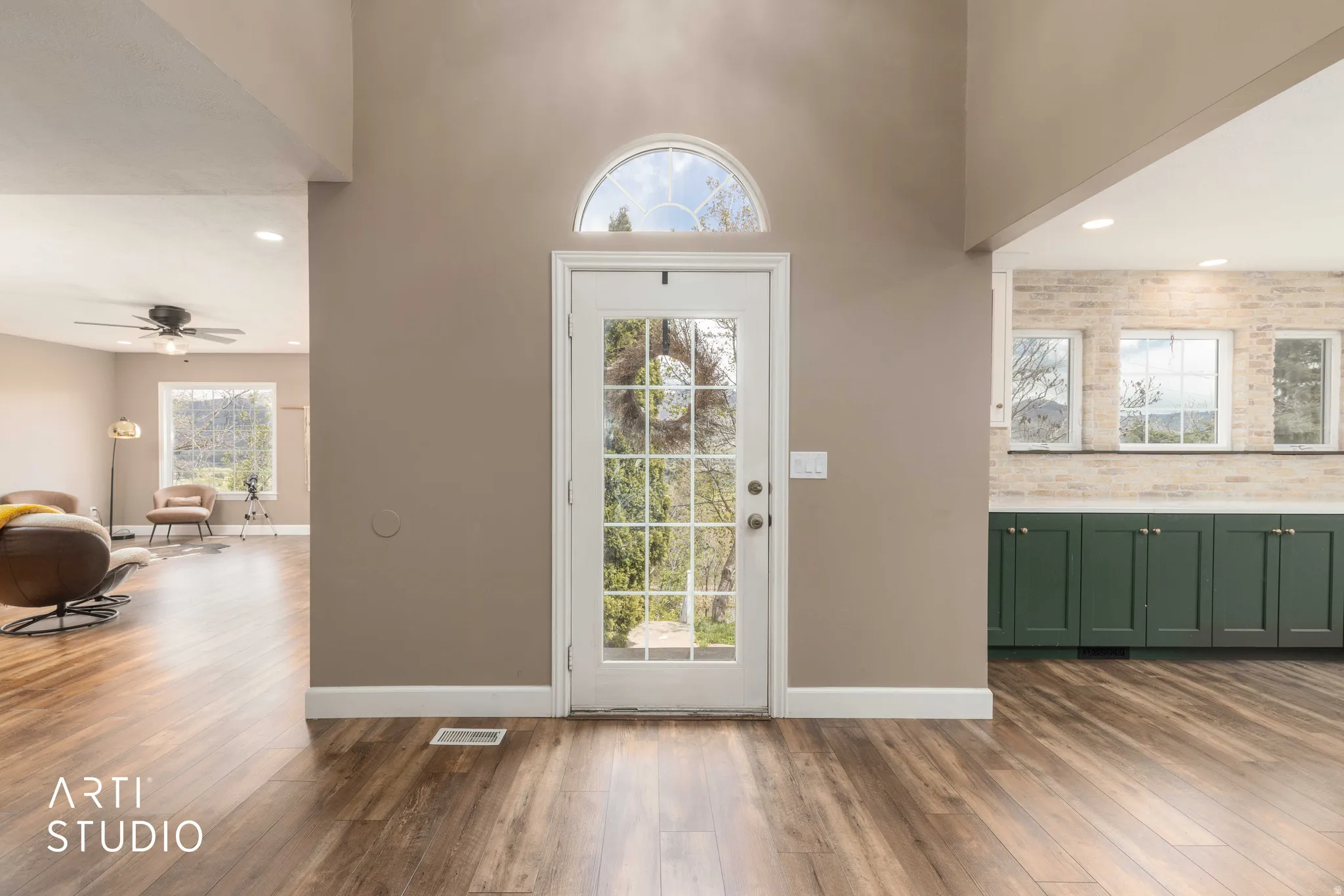 Entryway featuring recessed lighting, dark wood finished floors, a high ceiling, and a ceiling fan