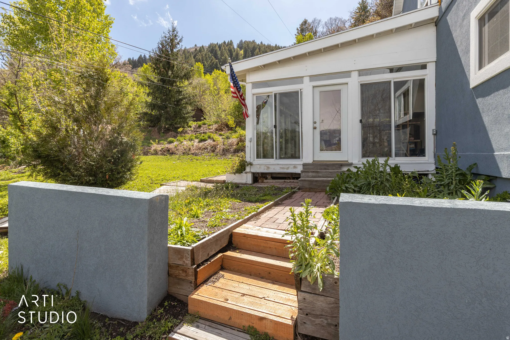 View of yard with entry steps