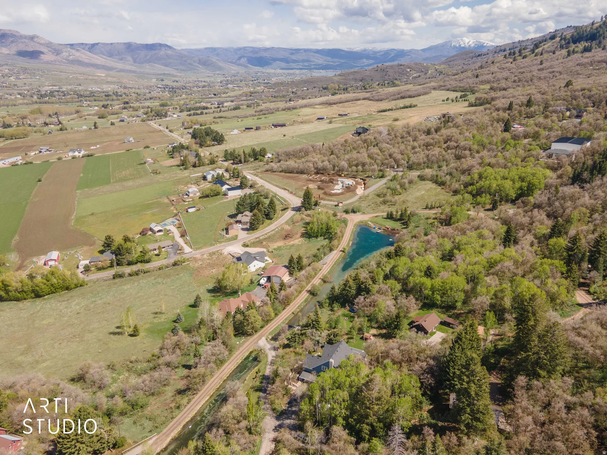 Overview of rural landscape with a water and mountain view