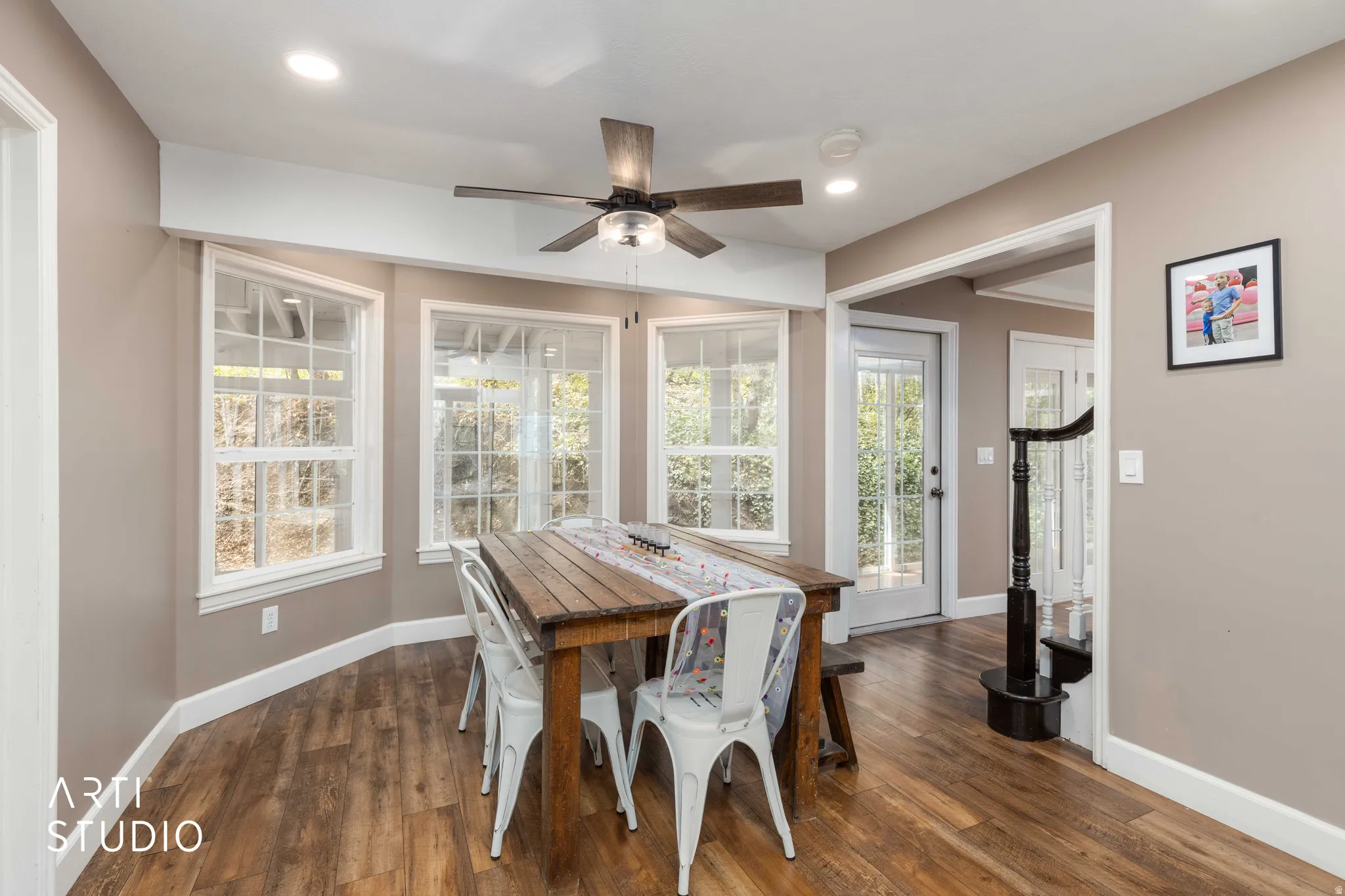 Dining space featuring a ceiling fan, dark wood-style floors, and recessed lighting