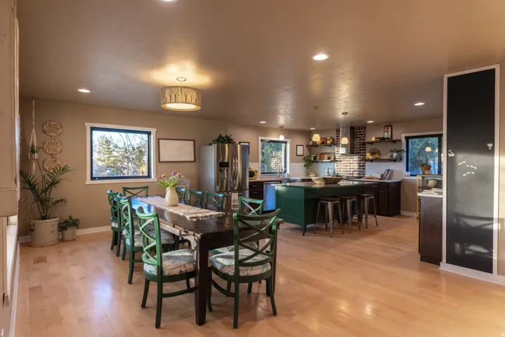 Dining space featuring light wood-type flooring and recessed lighting